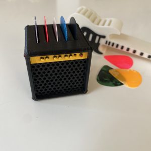 Porta uñetas amplificador